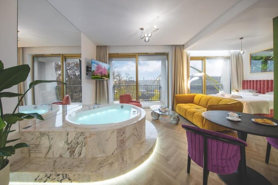 Apartment with jacuzzi Deluxe with river view | Private kitchen | Espresso maker, coffee/tea maker, full-size fridge, microwave