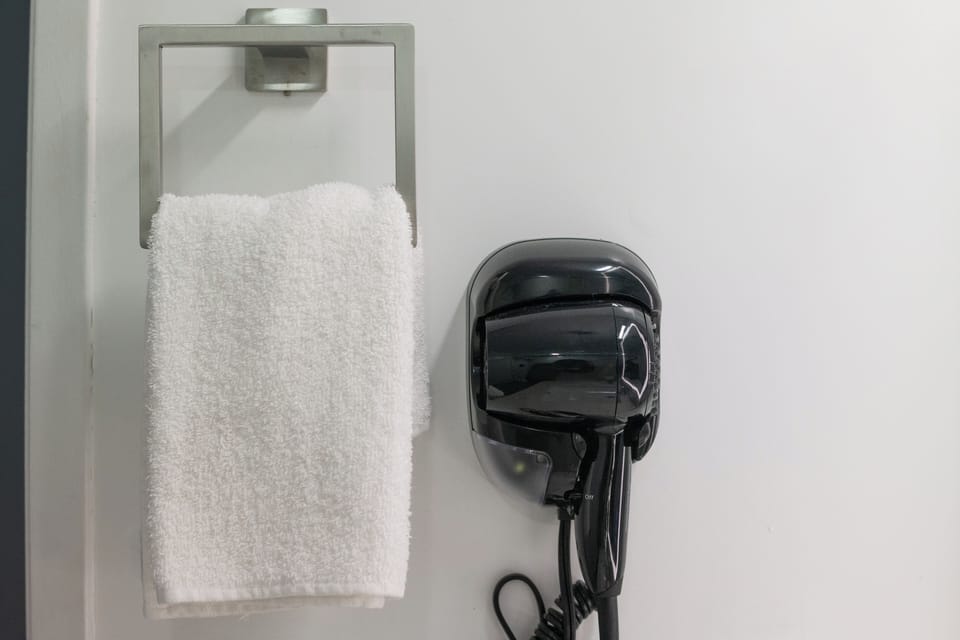 Hair dryer, towels, soap, shampoo