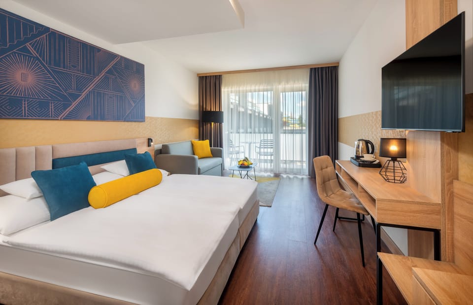 Standard Double or Twin Room | Minibar, in-room safe, desk, laptop workspace