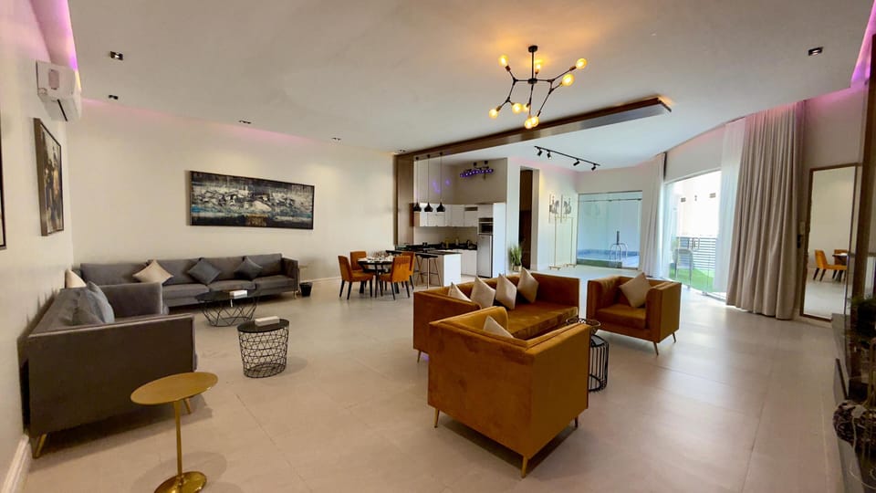 Deluxe Villa, Patio, Pool View | Living area