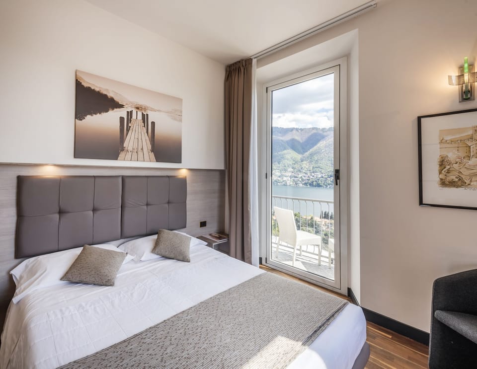Standard Double Room, Balcony, Lake View | Minibar, in-room safe, desk, laptop workspace