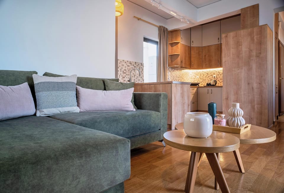 Apartment, Balcony, City View | Living room | 50-inch Smart TV with satellite channels, fireplace