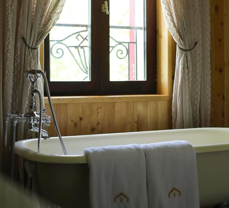 Luxury Suite, Balcony, Lake View | Bathroom | Separate tub and shower, free toiletries, hair dryer, slippers