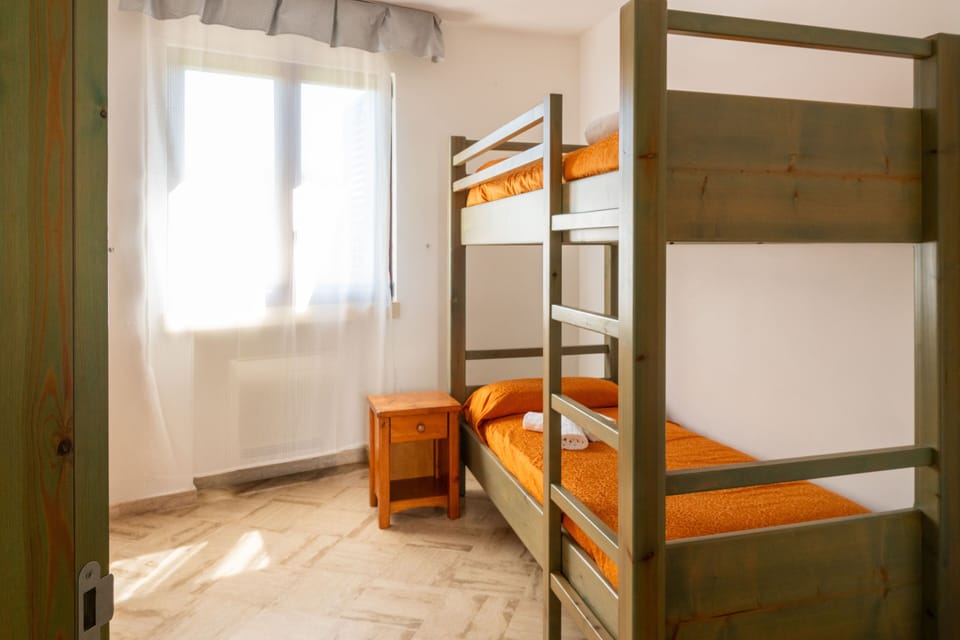 Family Apartment, Garden View | In-room safe, WiFi (free), bed sheets