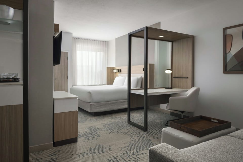 Desk, laptop workspace, iron/ironing board, free cribs/infant beds