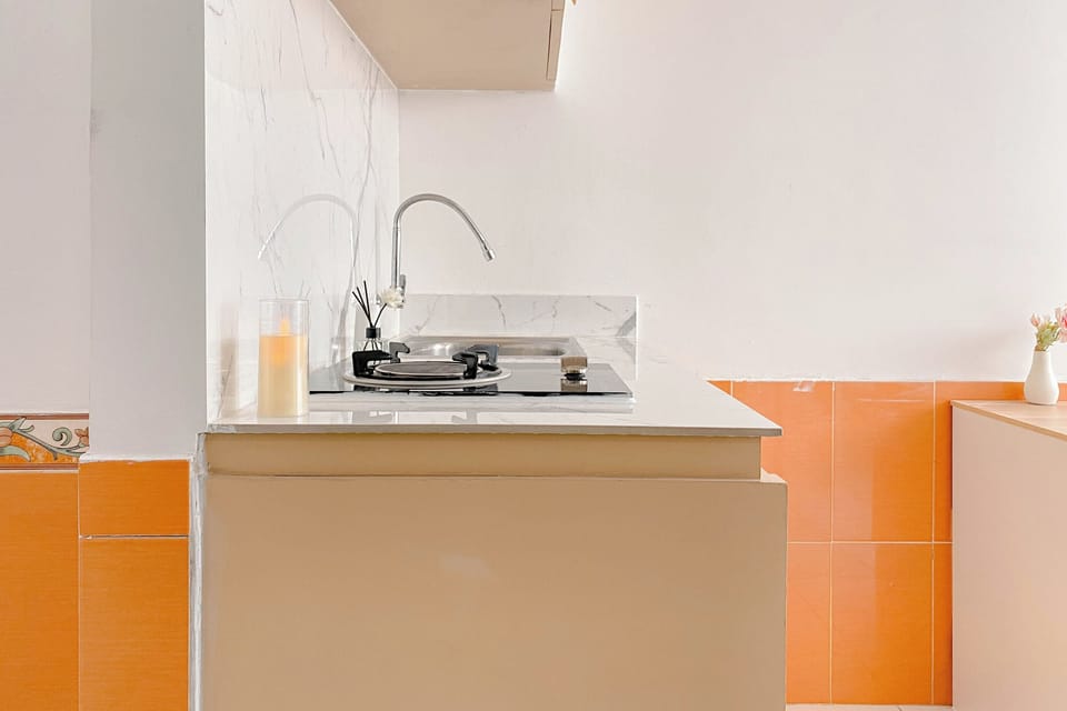 Apartment | Private kitchen | Full-size fridge, stovetop, rice cooker, dining tables