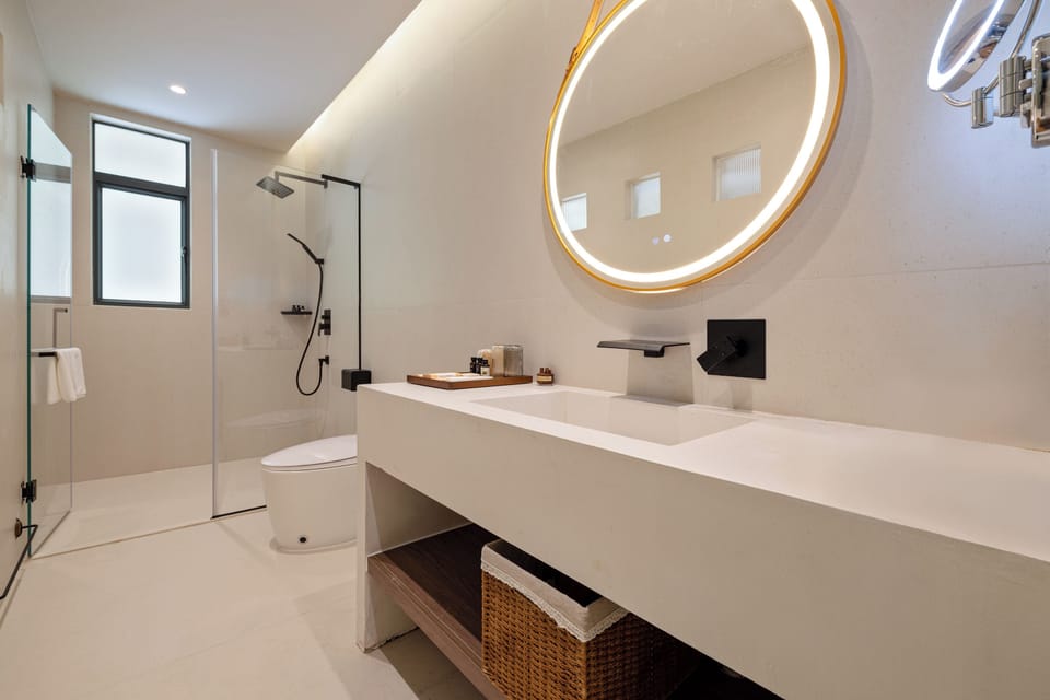 Separate tub and shower, hair dryer, slippers, towels