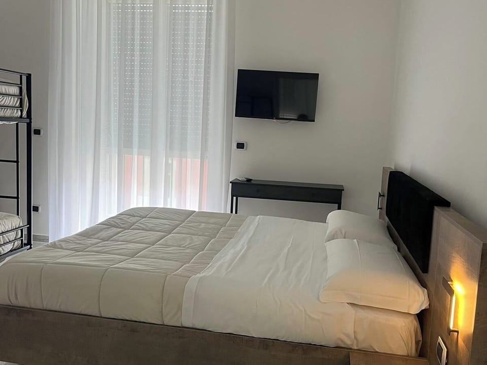 Family Quadruple Room, Balcony, City View | Desk, free WiFi