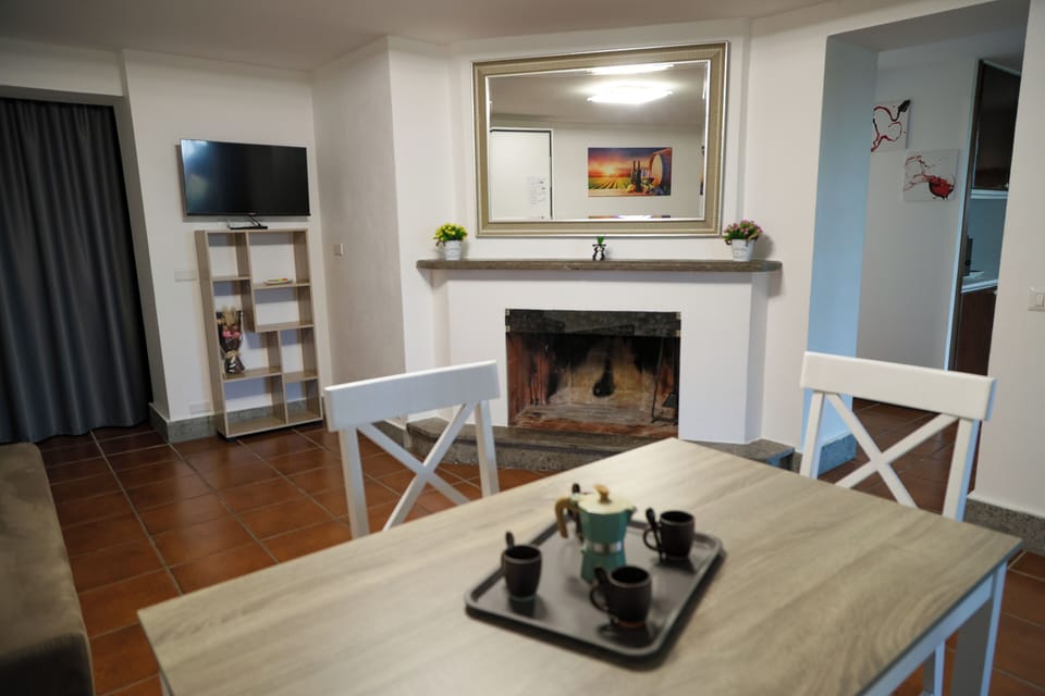 Deluxe Apartment, Garden View | Living area | 24-inch Smart TV with digital channels, Netflix, streaming services