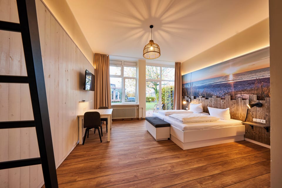 Quadruple Room, Roll-in Shower, Patio | Bathroom | Shower, hair dryer, towels, soap