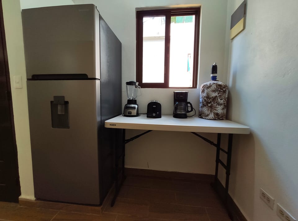 Family Quadruple Room, Patio, Pool View | In-room safe, laptop workspace, free WiFi