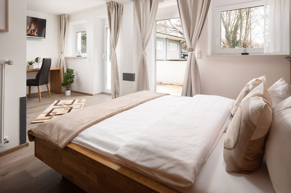Premium bedding, desk, laptop workspace, soundproofing