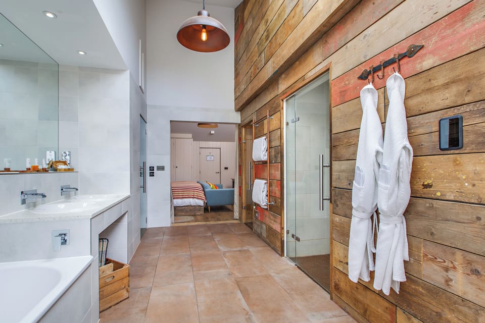 Suite | Bathroom | Separate tub and shower, hair dryer, bathrobes, slippers