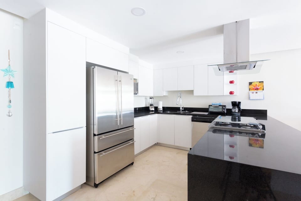 Apartment, Balcony, Pool View | Private kitchen | Full-size fridge, stovetop, coffee/tea maker, blender