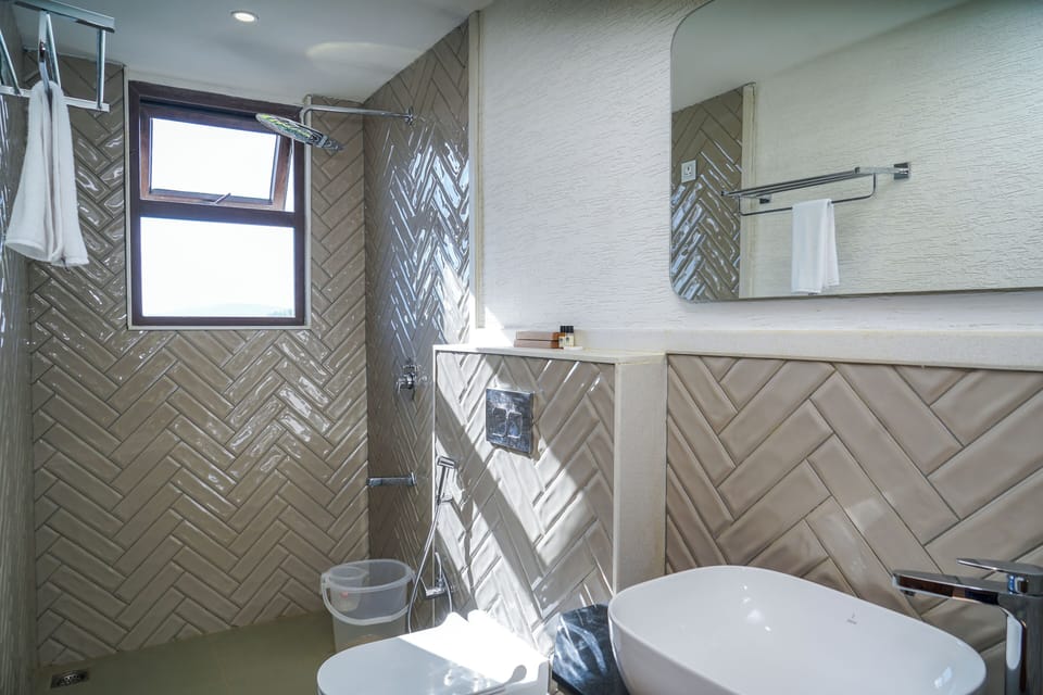 Family Studio | Bathroom | Shower, free toiletries, slippers, towels