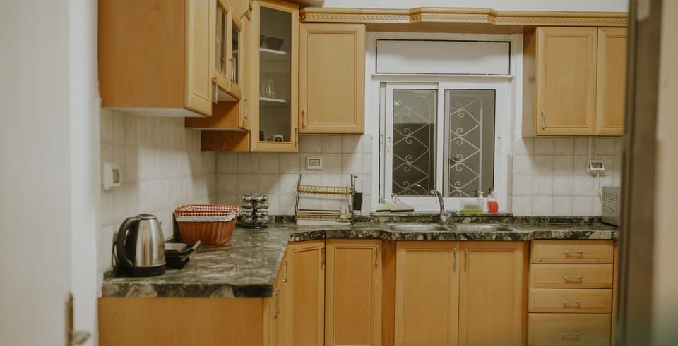 Full-size fridge, microwave, cookware/dishes/utensils