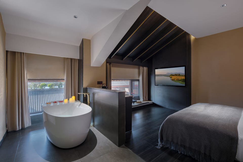 Luxury Suite, Lake View | Minibar (free items), desk, laptop workspace, WiFi (free)