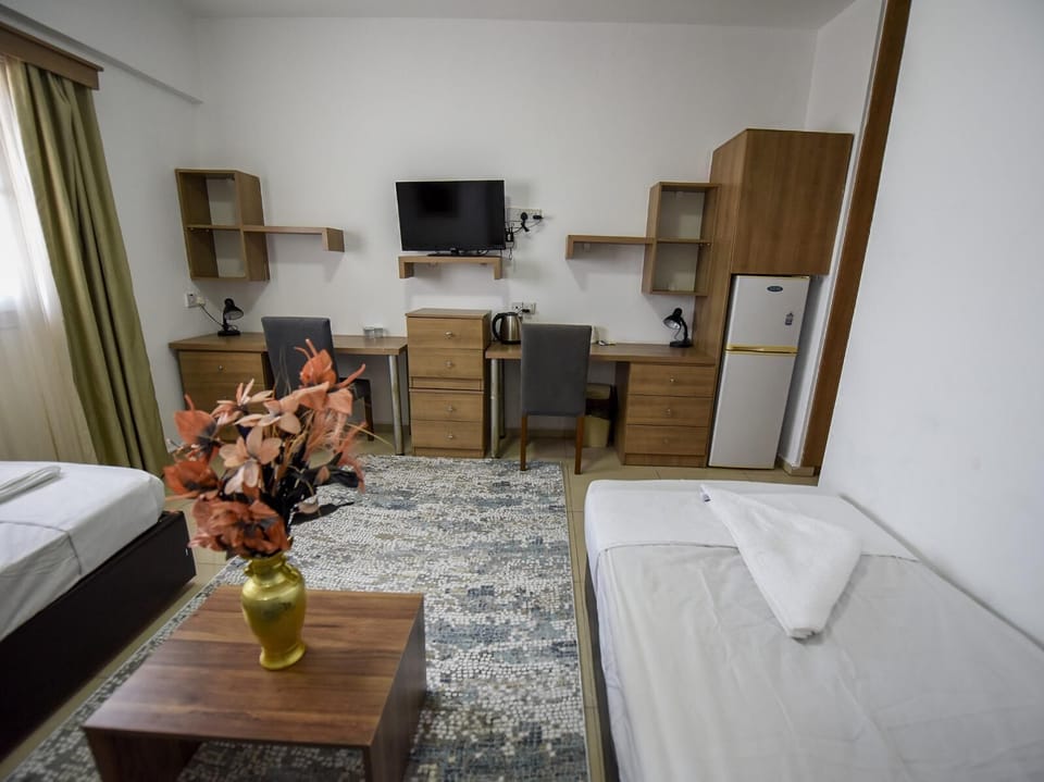 Basic Twin Room, Partial Sea View | Desk, laptop workspace, free WiFi