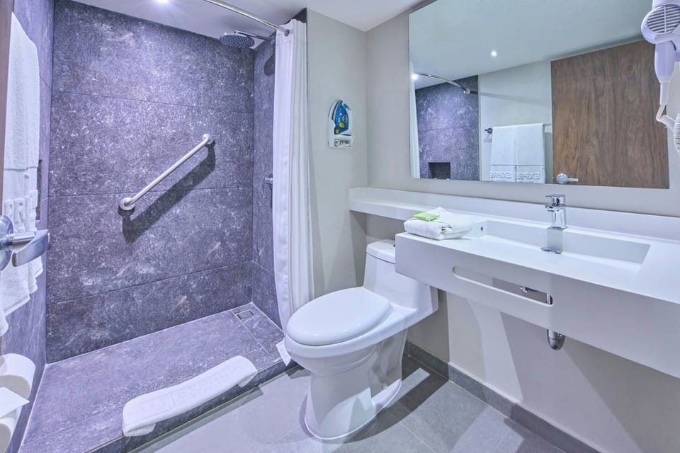 Shower, rainfall showerhead, hair dryer, towels