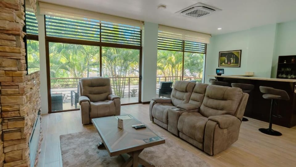 Deluxe Bungalow | Living area | 32-inch TV with cable channels, foosball, table tennis