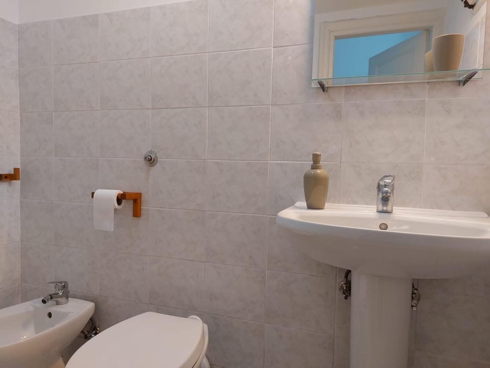 Apartment, Balcony, City View | Bathroom | Hair dryer, towels