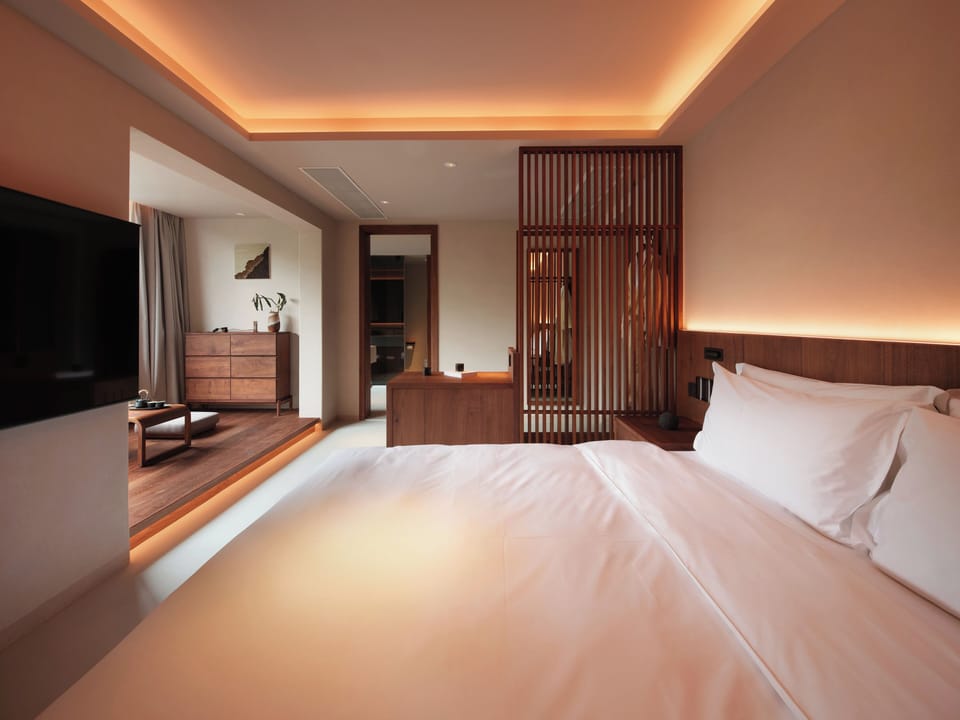 Superior Suite, City View | Living area | 65-inch LCD TV with cable channels, toys, books