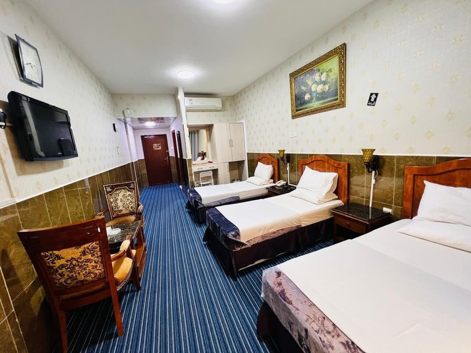 Triple Room, Balcony | In-room safe, blackout drapes, soundproofing, iron/ironing board