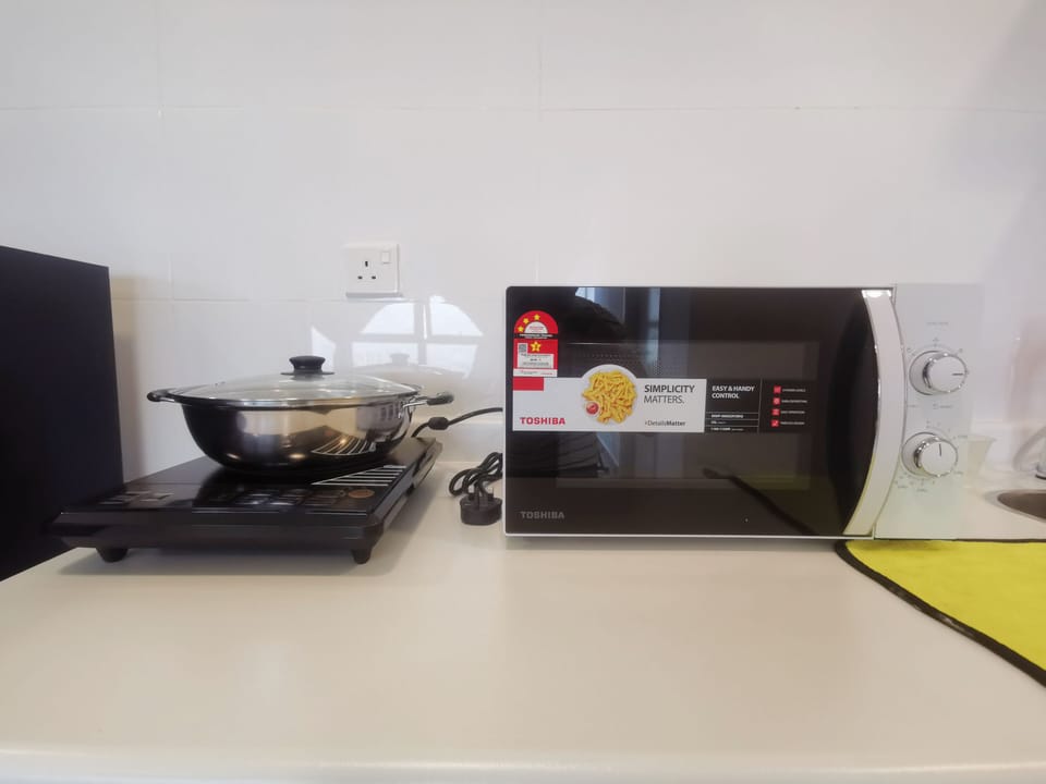 Apartment, 2 Bedrooms | Private kitchen | Fridge, microwave, electric kettle, dining tables