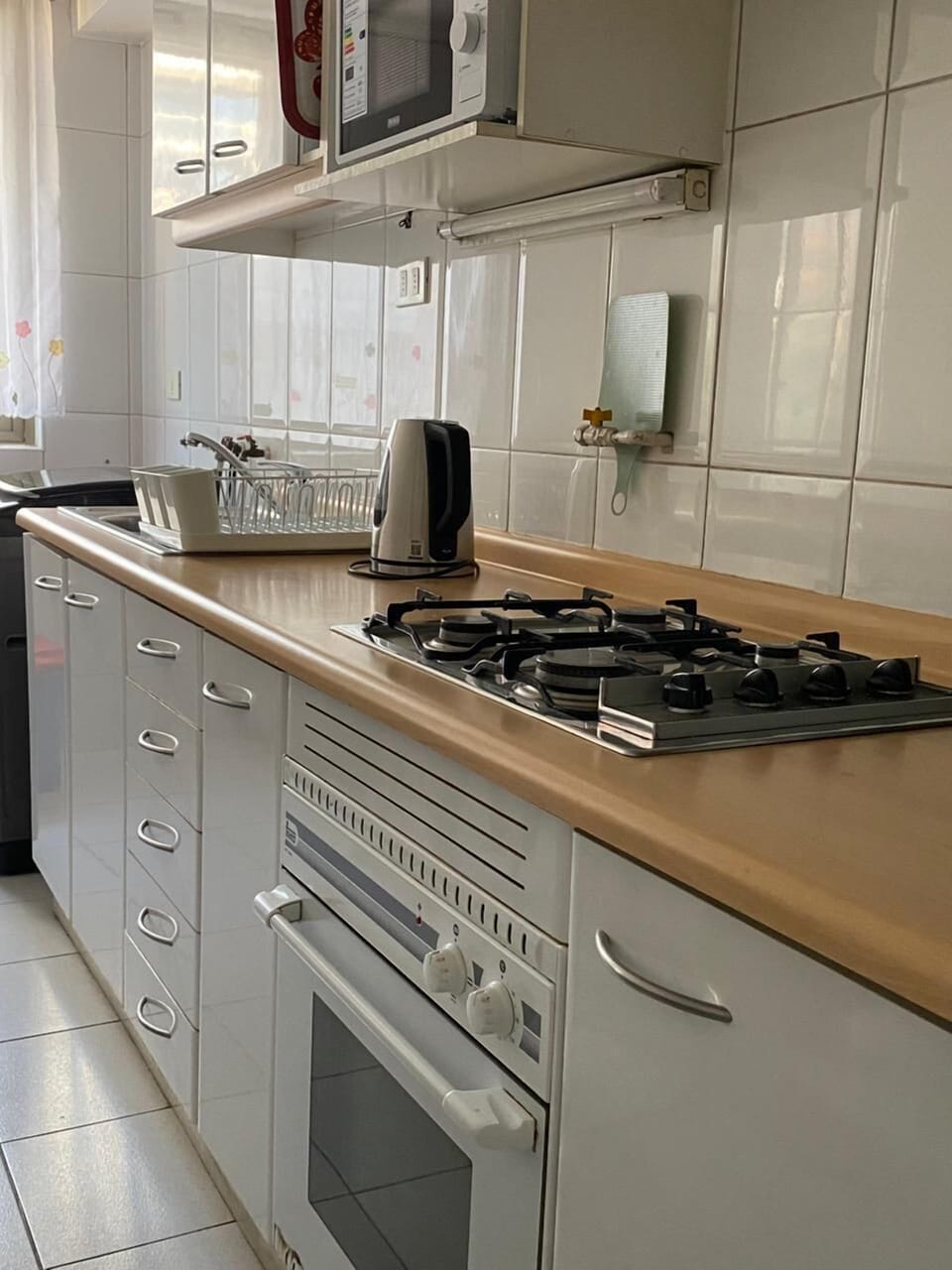 Family Apartment | Private kitchen | Full-size fridge, microwave, stovetop, cookware/dishes/utensils