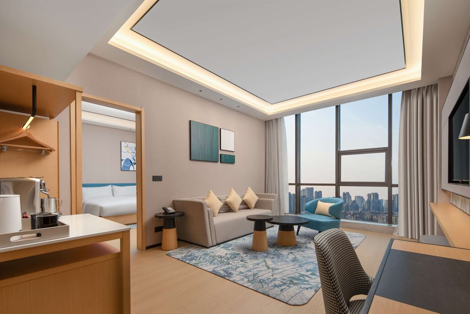 Deluxe Suite, 1 King Bed | Living area | LCD TV