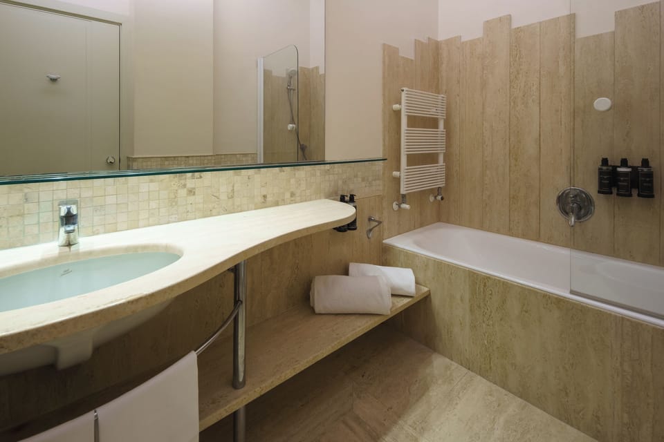 Eco-friendly toiletries, hair dryer, bidet, towels