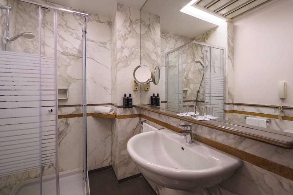 Eco-friendly toiletries, hair dryer, bidet, towels