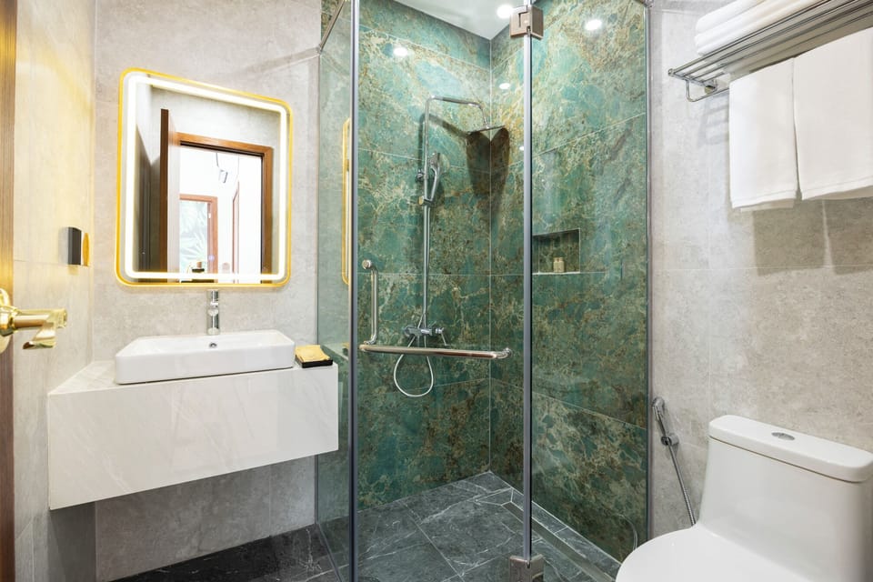 Shower, hair dryer, slippers, towels