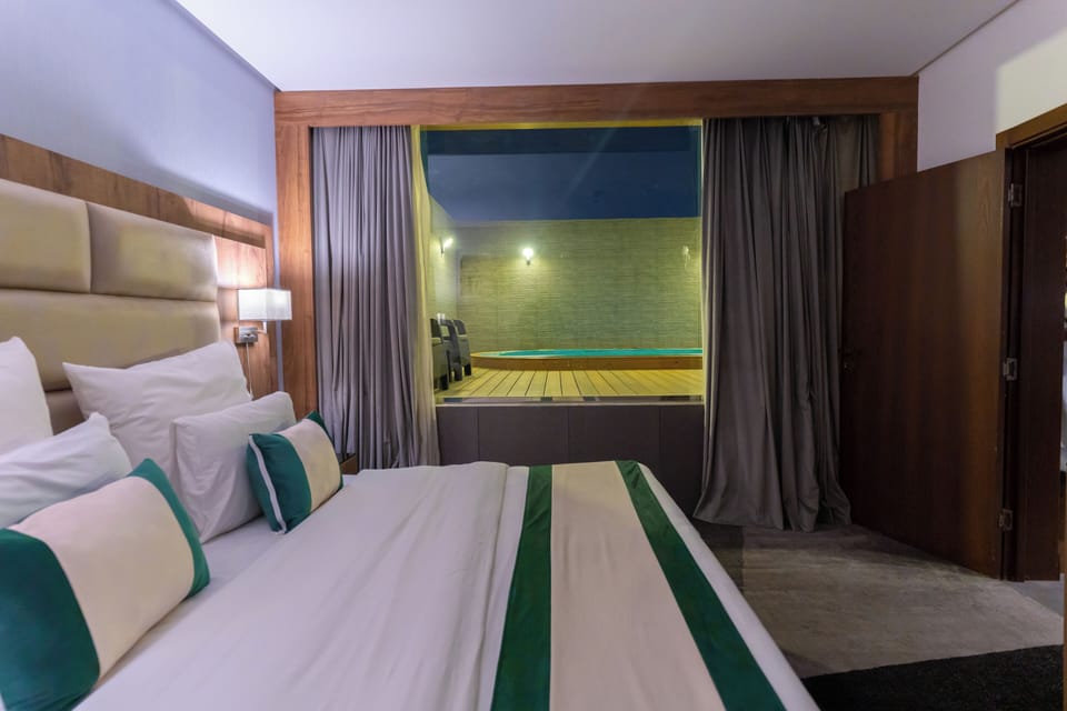 Premium Suite, Private Pool | In-room safe, desk, laptop workspace, blackout drapes