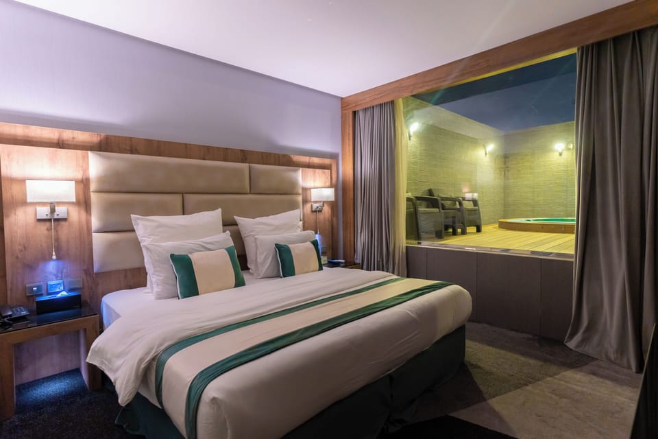 Premium Suite, Private Pool | In-room safe, desk, laptop workspace, blackout drapes