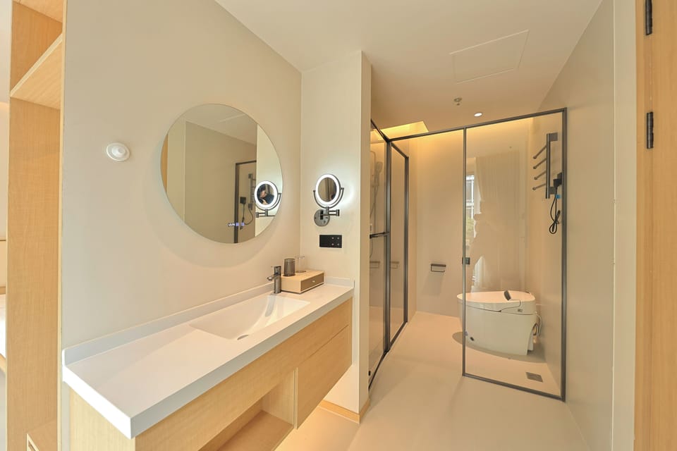 Shower, hair dryer, slippers, towels