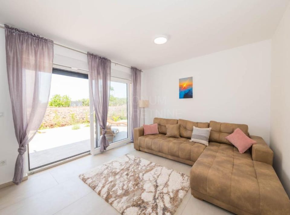 Villa (Four Bedroom Villa with Pool) | Living room | 32-inch flat-screen TV with cable channels