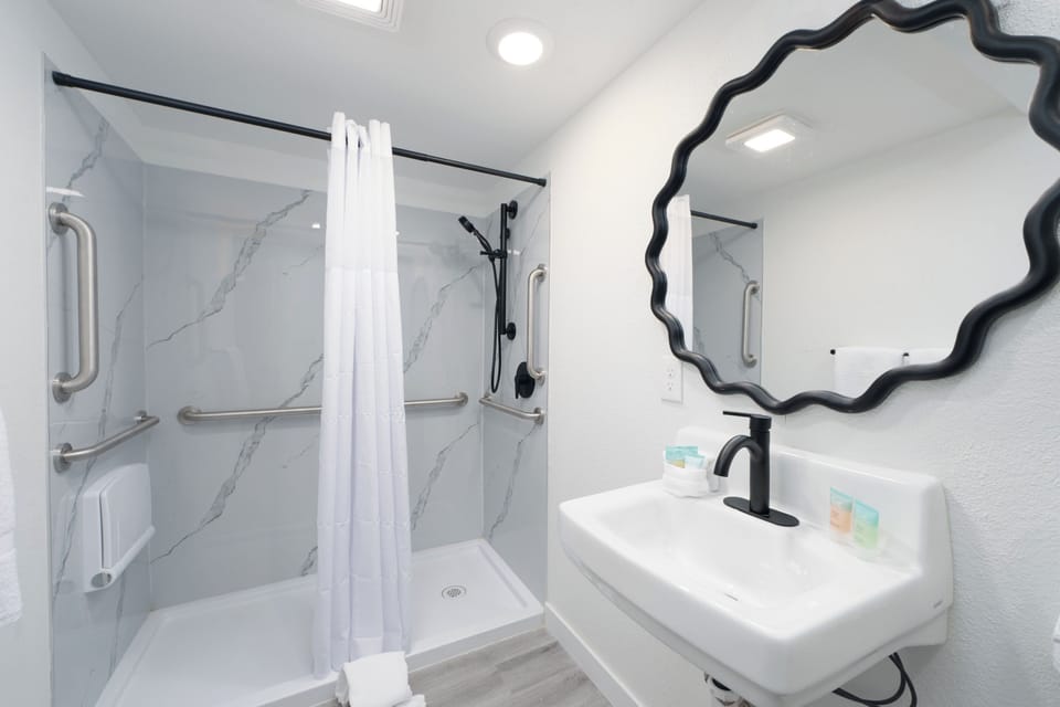 Room, 2 Queen Beds | Bathroom | Shower, free toiletries, towels, toilet paper