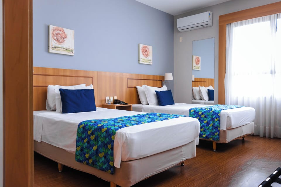 Deluxe Room, 2 Twin Beds | Minibar, in-room safe, individually decorated, desk