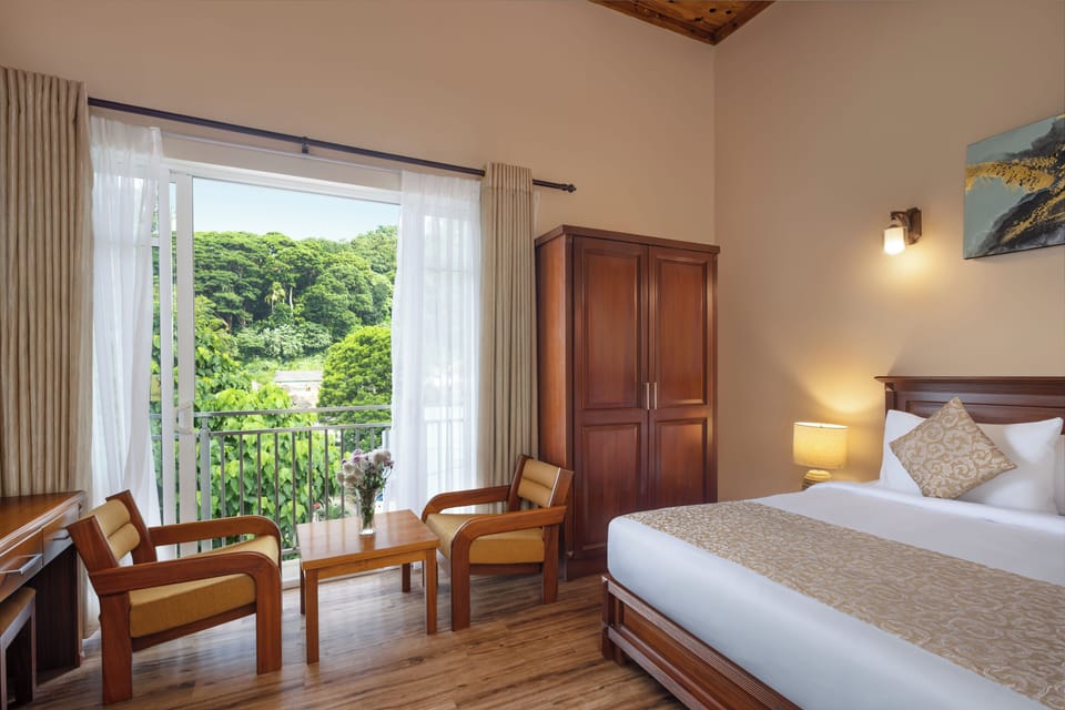 Deluxe Double Room, Balcony, Mountain View | In-room safe, desk, laptop workspace, blackout drapes
