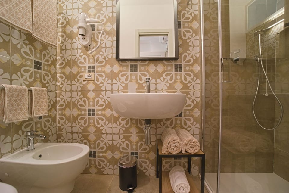 Basic Double Room, Patio, Courtyard View | Bathroom | Shower, hair dryer, bathrobes, bidet