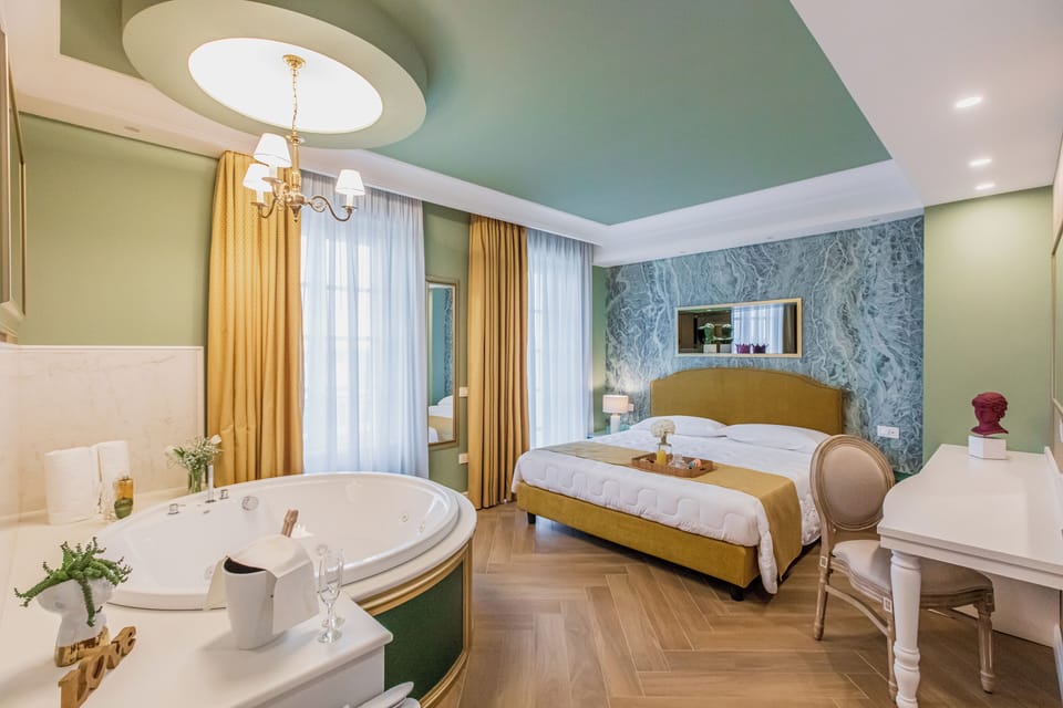 Deluxe Room, Lake View | Minibar, desk, laptop workspace, blackout drapes