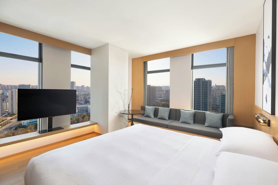 Premium Room, 1 King Bed, City View | In-room safe, laptop workspace, blackout drapes, free cribs/infant beds