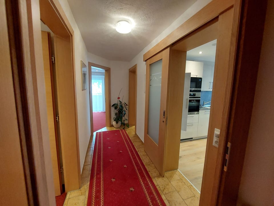 Deluxe Condo, 3 Bedrooms, Balcony, River View | Living area | 43-inch flat-screen TV with digital channels, books, offices