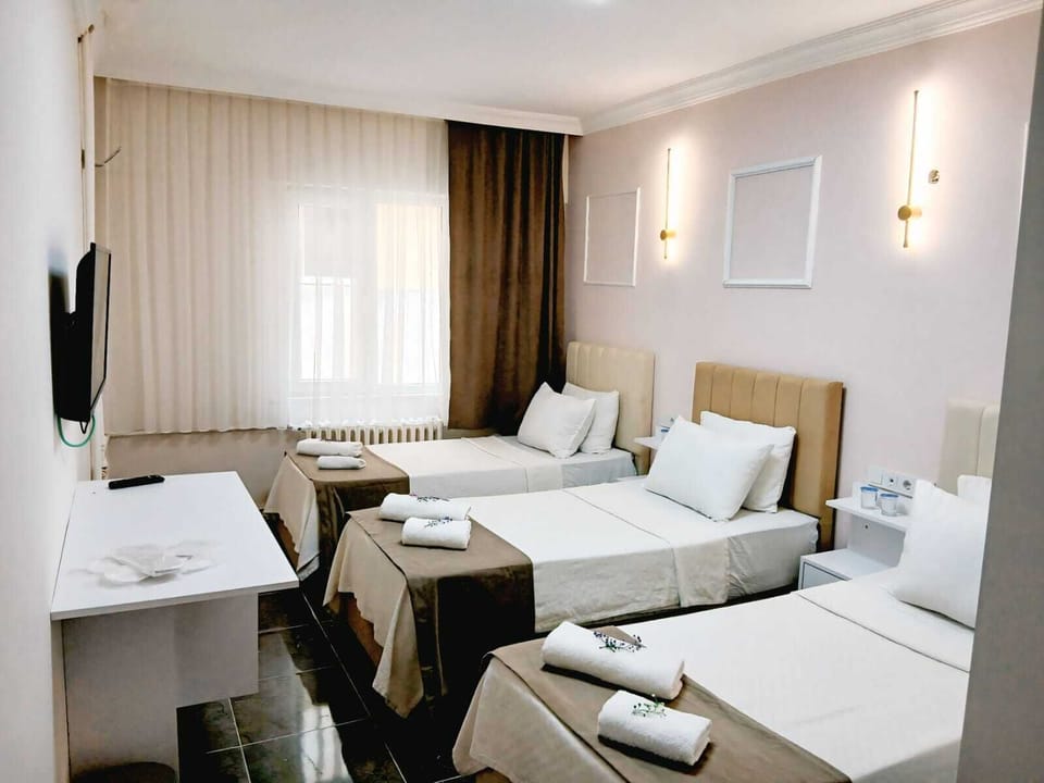 Triple Room | Desk, laptop workspace, blackout drapes, iron/ironing board