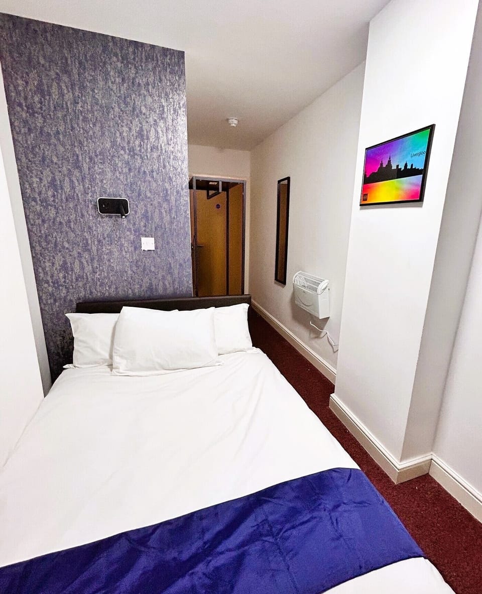 Economy Double Room | Desk, laptop workspace, blackout drapes, iron/ironing board