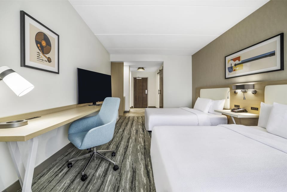 Room, 2 Queen Beds | Blackout drapes, iron/ironing board, free cribs/infant beds, bed sheets