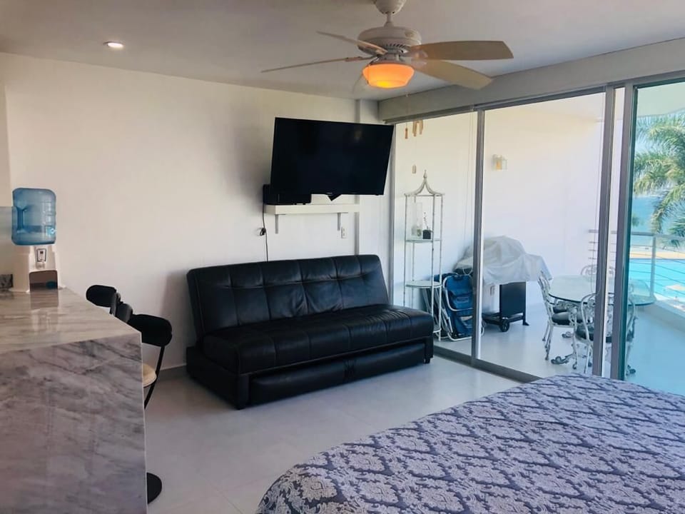 Studio, Balcony, Ocean View | Living area | 27-inch Smart TV with digital channels
