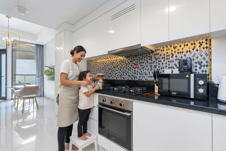 Luxury Studio Suite, City View | Private kitchen | Fridge, microwave, oven, stovetop