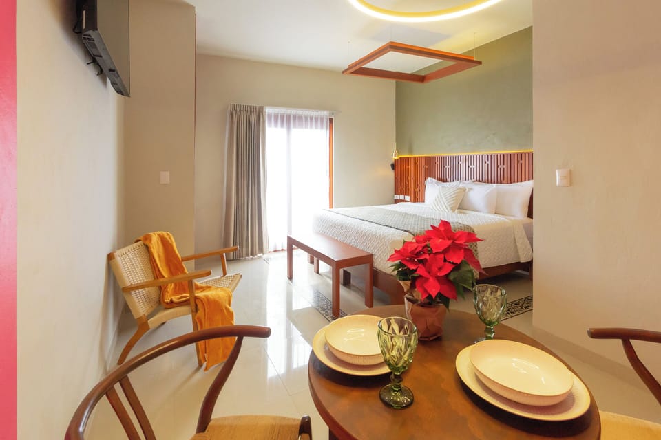 Family Room, Balcony, Courtyard View | In-room safe, laptop workspace, iron/ironing board, free WiFi